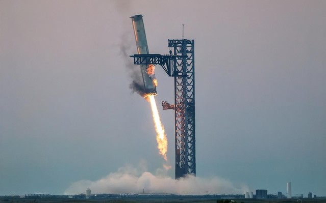 SpaceX Starship Super Heavy landing in the launch tower's Mechazilla Chopsticks on the Flight 5 mission; used with permission